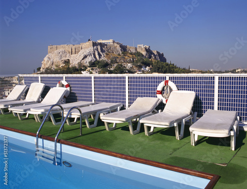 Photo: Swimmingpool and at background the Acropolis Swimmingpool and at background the Acropolis