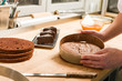 Cook taking out cake from cake form
