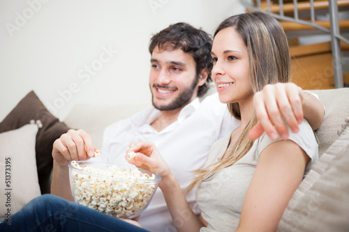 Photo: Couple watching a movie Couple watching a movie
