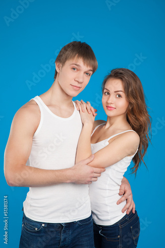 Photo: young love couple holding each other in the studio young love couple holding each other in the studio