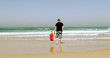 father and daughter on the beach