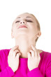 Young beautiful woman scratching her self.