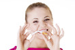 Young woman with broken cigarette.