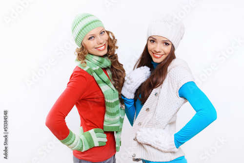 Photo: Young woman wearing winter hat and warm scarf Young woman wearing winter hat and warm scarf