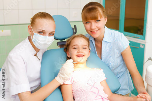 Photo: Little girl visiting dentist Little girl visiting dentist