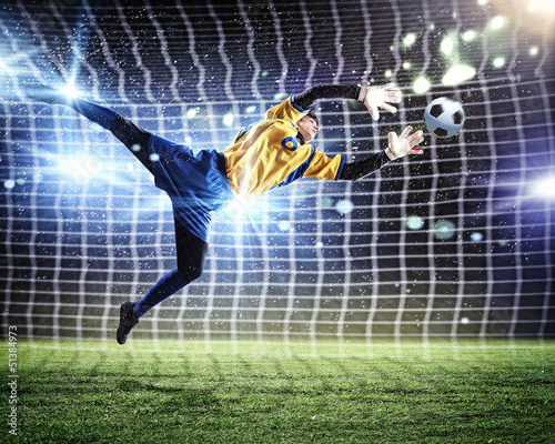 Photo: Goalkeeper catches the ball Goalkeeper catches the ball