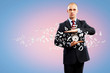Business man holding alarmclock