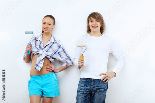 Photo: Couple with paint brushes Couple with paint brushes