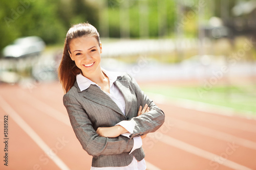 Photo: Business woman at athletic stadium Business woman at athletic stadium