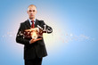 Business man holding alarmclock