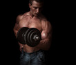 Man with a bar weights in hands training. Bodybuilding
