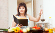  housewife cooking with book