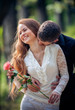 Photo: Love and affection between a young couple at the park Love and affection between a young couple at the park