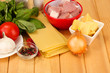Photo: Lasagna ingredients on wooden background Lasagna ingredients on wooden background