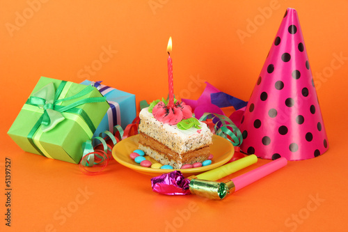 Photo: Colorful birthday cake with candle and gifts Colorful birthday cake with candle and gifts