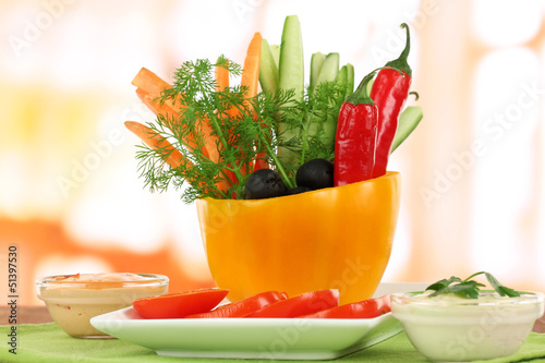 Photo: Assorted raw vegetables sticks in pepper bowl Assorted raw vegetables sticks in pepper bowl