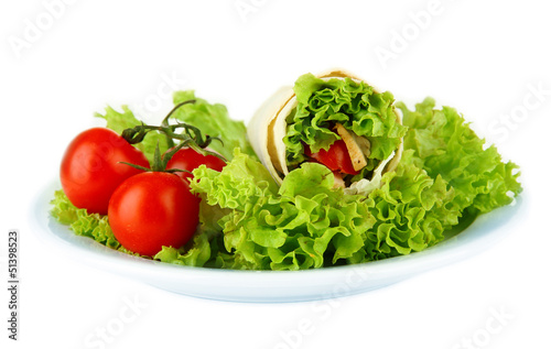 Photo: Kebab - grilled meat and vegetables, on plate, isolated on Kebab - grilled meat and vegetables, on plate, isolated on
