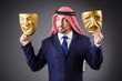 Foto: Arab with masks in dark studio Arab with masks in dark studio