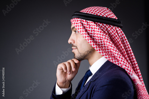 Photo: Arab businessman in dark studio Arab businessman in dark studio