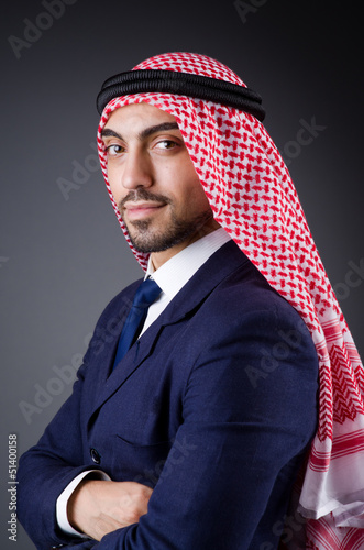 Photo: Arab businessman in dark studio Arab businessman in dark studio