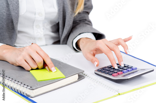 Photo: Hands working on the calculator Hands working on the calculator