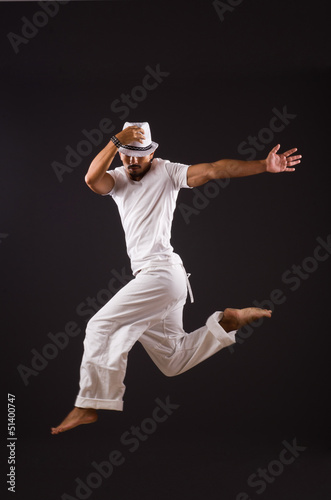 Photo: Dancer dancing in the dark studio Dancer dancing in the dark studio