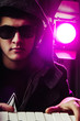 DJ mixing music at disco