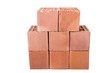 Stack of clay bricks isolated on white
