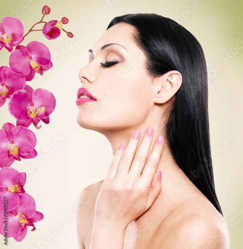 Photo: woman with beautiful face and fresh flowers woman with beautiful face and fresh flowers