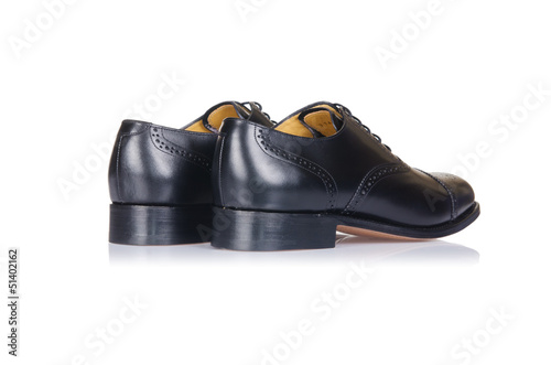 Photo: Fashion concept with male shoes on white Fashion concept with male shoes on white