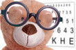 Teddy with glasses at the eye doctor