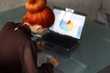 Redhead businesswoman writing
