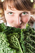 woman and fresh savoy cabbage