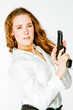 Young and beautiful woman with a gun
