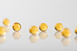 yellow capsules isolated on white