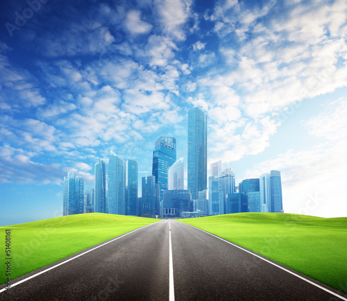 Photo: Asphalt road and modern city Asphalt road and modern city