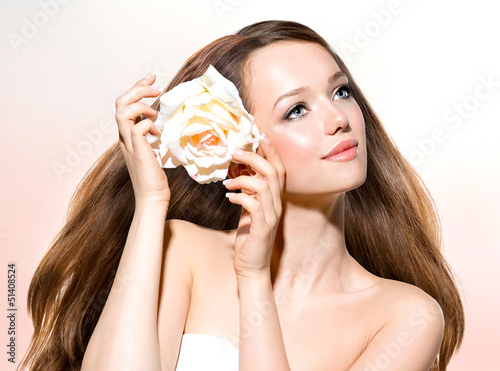 Photo: Beauty Girl. Beautiful Model with Rose Flower Beauty Girl. Beautiful Model with Rose Flower