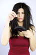 Sad woman holding fallen hair healthcare problems