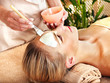 Woman getting  facial massage .