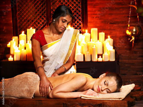 Photo: Woman having Ayurvedic spa treatment. Woman having Ayurvedic spa treatment.