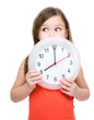 Little girl is holding big clock