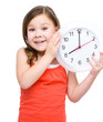 Little girl is holding big clock
