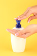 woman squeezing lotion