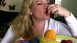Woman eating fruit