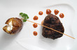 Tenderloin steak portion with potato on white background