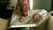 Woman Looking at a Photo Album