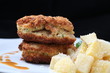 Chicken cordon bleu on black background