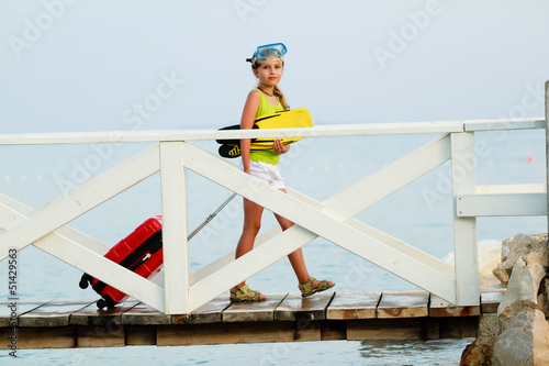 Photo: Traveler, summer - lovely girl ready for summer vacation Traveler, summer - lovely girl ready for summer vacation