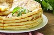 pile of fried bread with butter and parsley