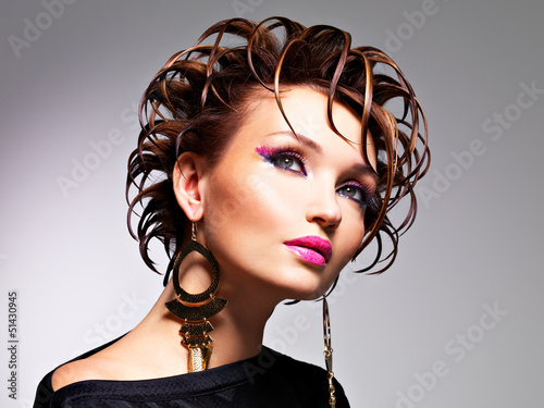Photo: Beautiful woman with fashion hairstyle and glamour makeup Beautiful woman with fashion hairstyle and glamour makeup